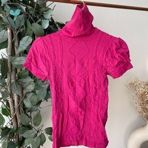 Pink turtleneck